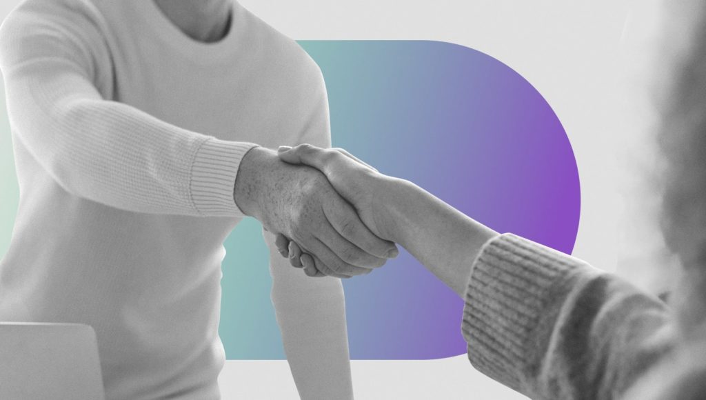 An applicant and interviewer shaking hands after answering "What are your weaknesses?".